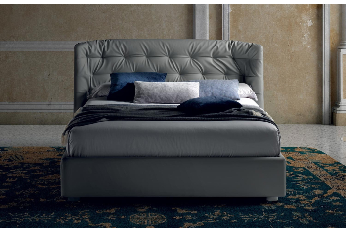 Letto in ecopelle matrimoniale contenitore con testiera curva trapuntata
