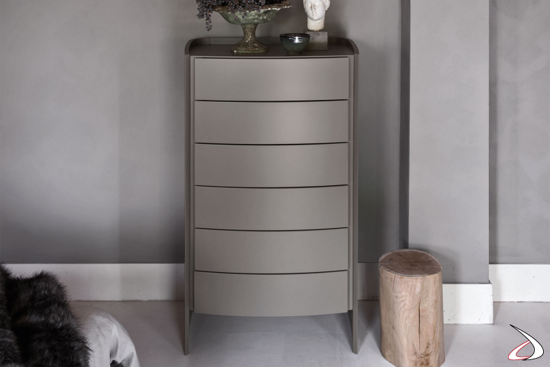 Design bedside cabinet raised from the ground with six matt lacquered drawers.