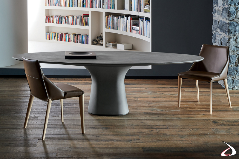 Tavolo ovale di design da soggiorno con piano e basamento in cemento