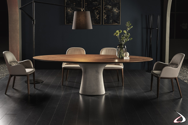 Tavolo ovale da soggiorno con piano in legno impiallacciato noce e basamento centrale in cemento