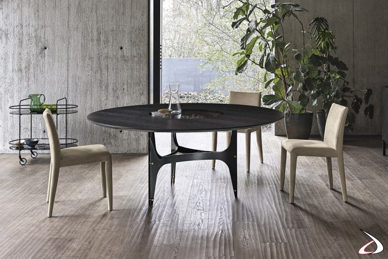 Tavolo rotondo elegante in legno impiallacciato con piano centrale girevole incassato in cristallo fumè