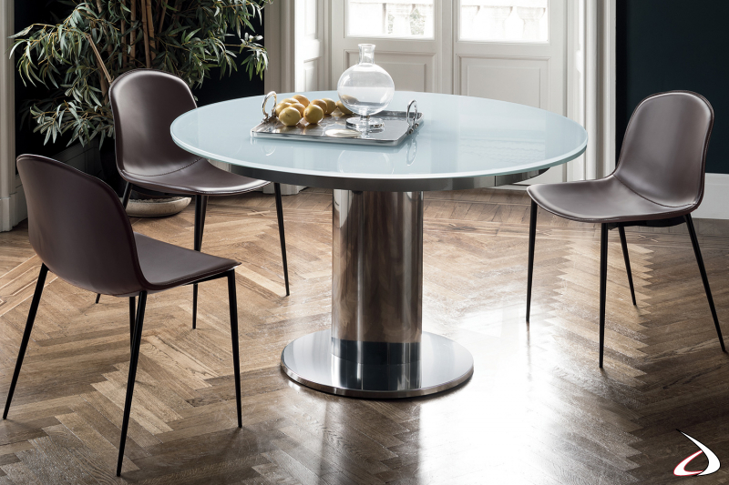 Tavolo rotondo allungabile di design con gamba centrale e piano in cristallo