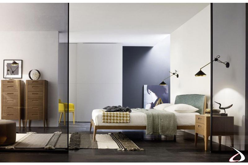Camera da letto moderna con comodino e settimini