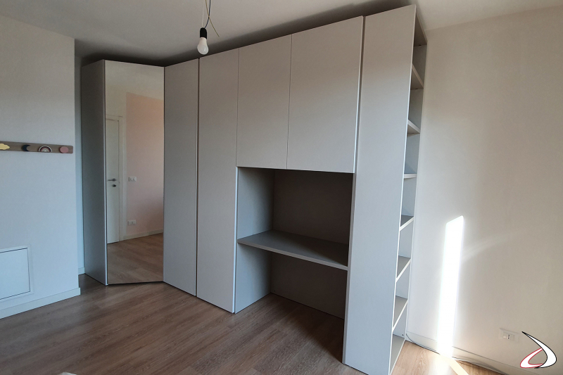 Corner wardrobe with walk-in wardrobe, desk and bookcase for girl's room