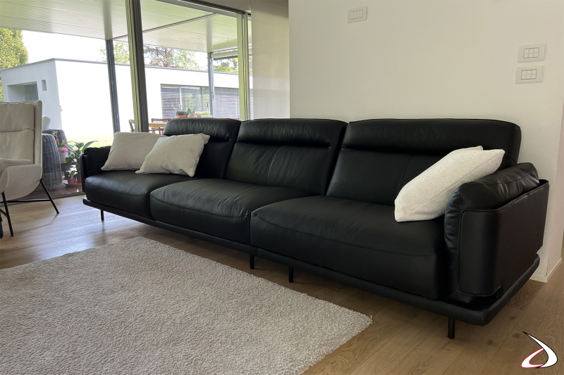 Realisation of living room furniture with leather sofa and armchair with ottoman