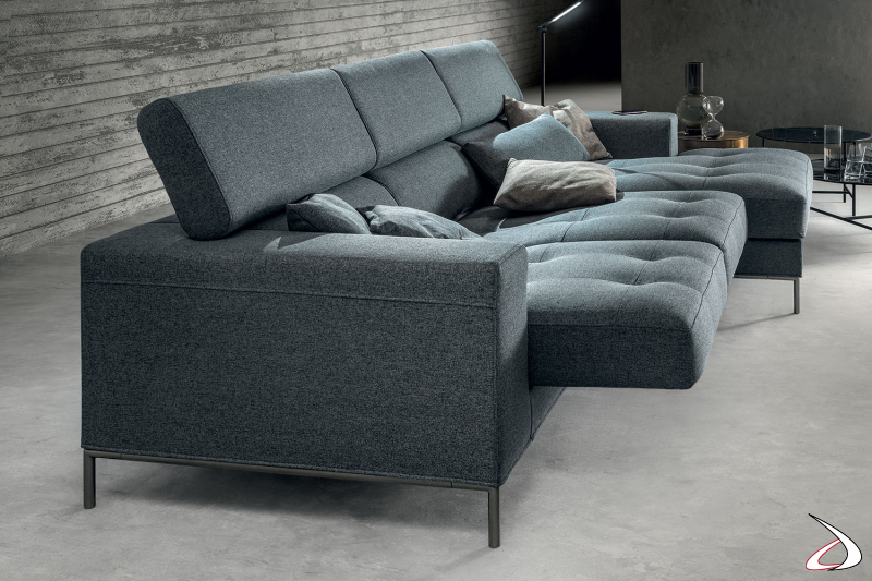 Sofa with peninsula with quilted sliding seats and reclining headrests