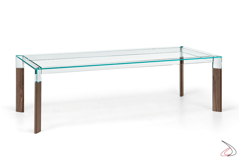 Tavolo grande di design in vetro trasparente con gambe in legno massello noce canaletto