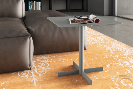 High metal coffee table in the shape of a four-leaf clover