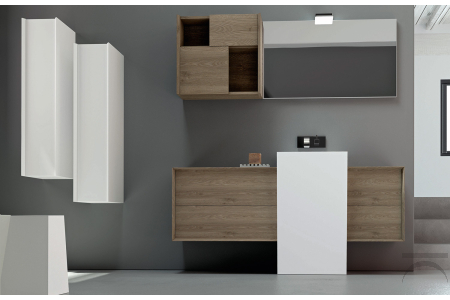 Bagno moderno con lavabo a terra centrato e basi con cassettoni