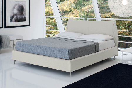 Upholstered double bed with glamor headboard