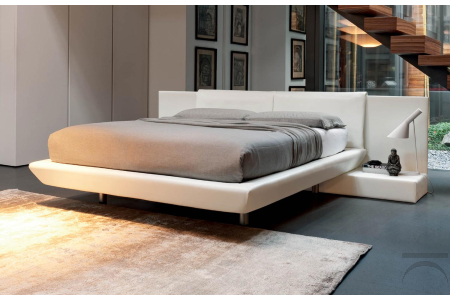 Double bed design with integrated padded bedside tables
