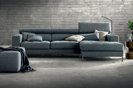 Design sofa with peninsula, reclining headrests and quilted pull-out seats