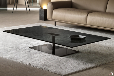 Moderna mesa de centro redonda con tapa de cristal, soporte metálico y base cromada de espejo para dar luz al ambiente.
