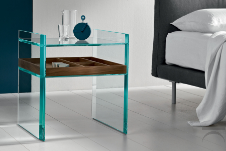 Modern coffee table with a simple and versatile glass design, featuring a lowered shelf and beveled edges
