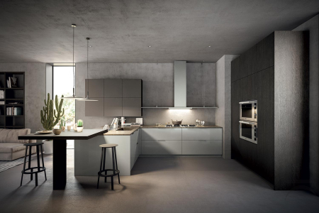 Modern kitchen with peninsula and high snack table, complete with household appliances and designer hood