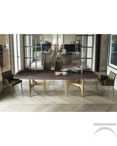 Tavolo lungo di design con piano a botte in supermarmo e doppio basamento in acciaio color oro