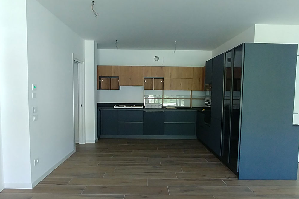 Open-plan living area before the refurbishment project