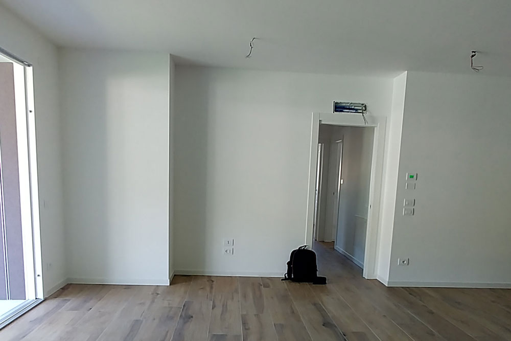 Open-plan living area before the refurbishment project