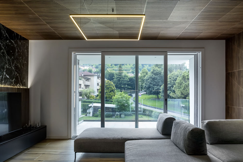 Apartment in Conegliano: open-plan kitchen and living room after refurbishment